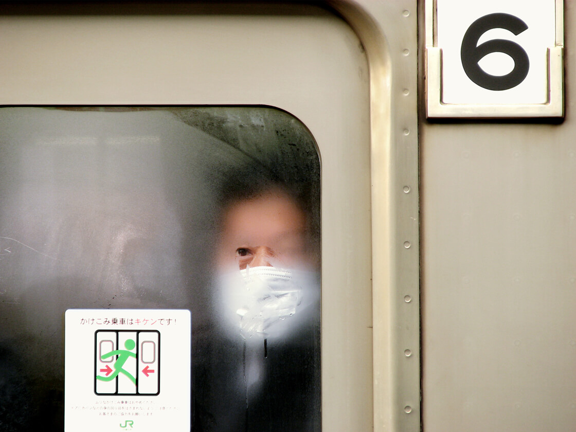 a salaryman on a train in Akabane station