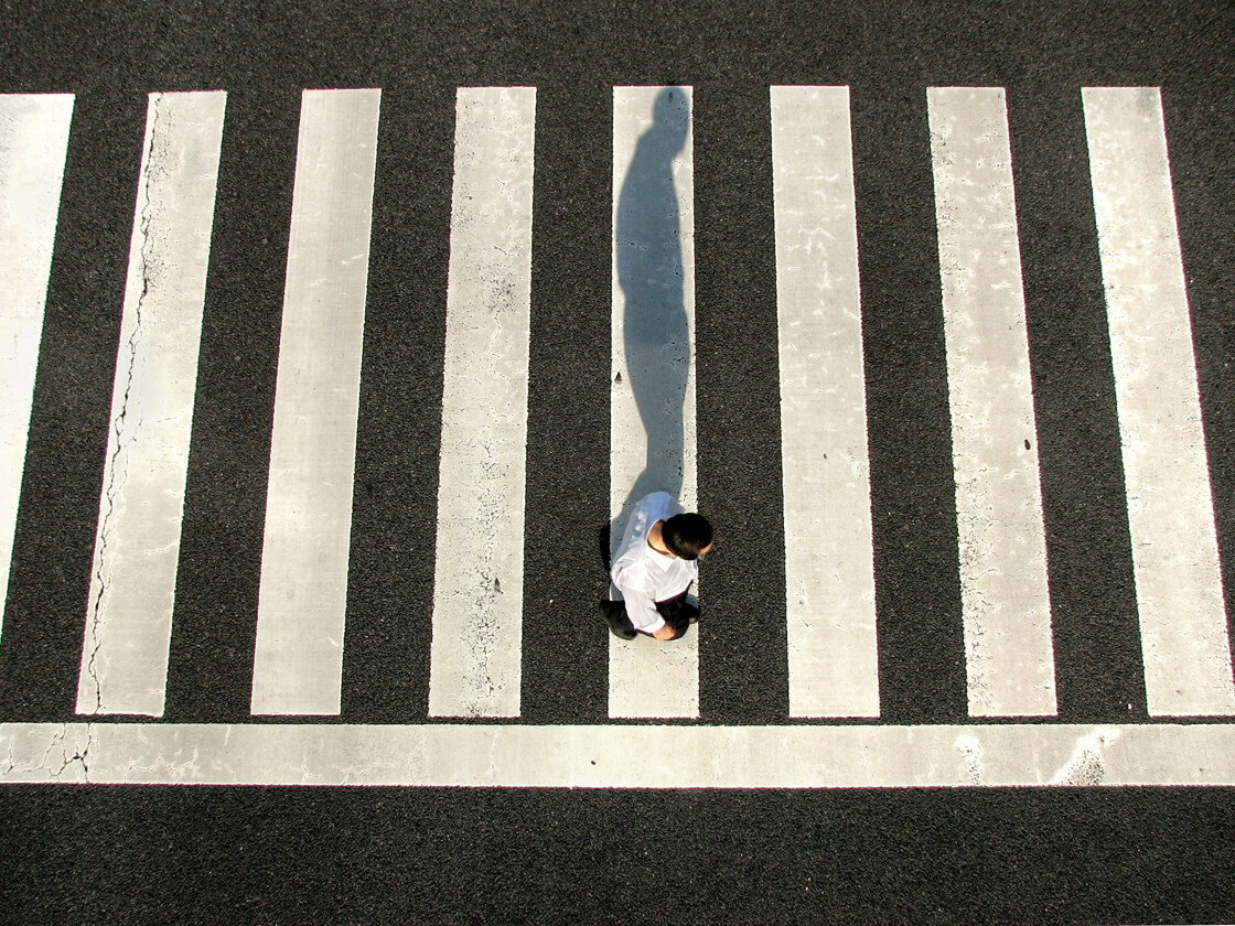 a salaryman on a pedestrian crossing in Suidobashi