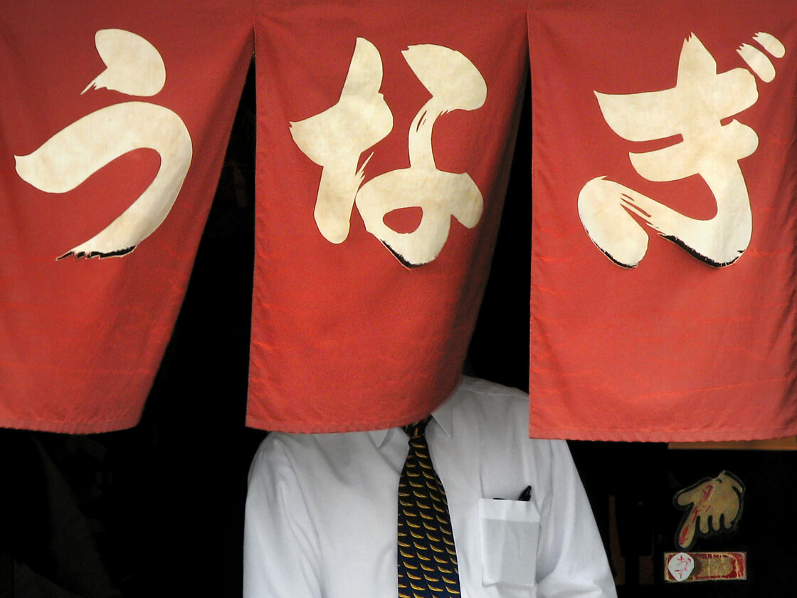 a salaryman getting out of a eel restaurant