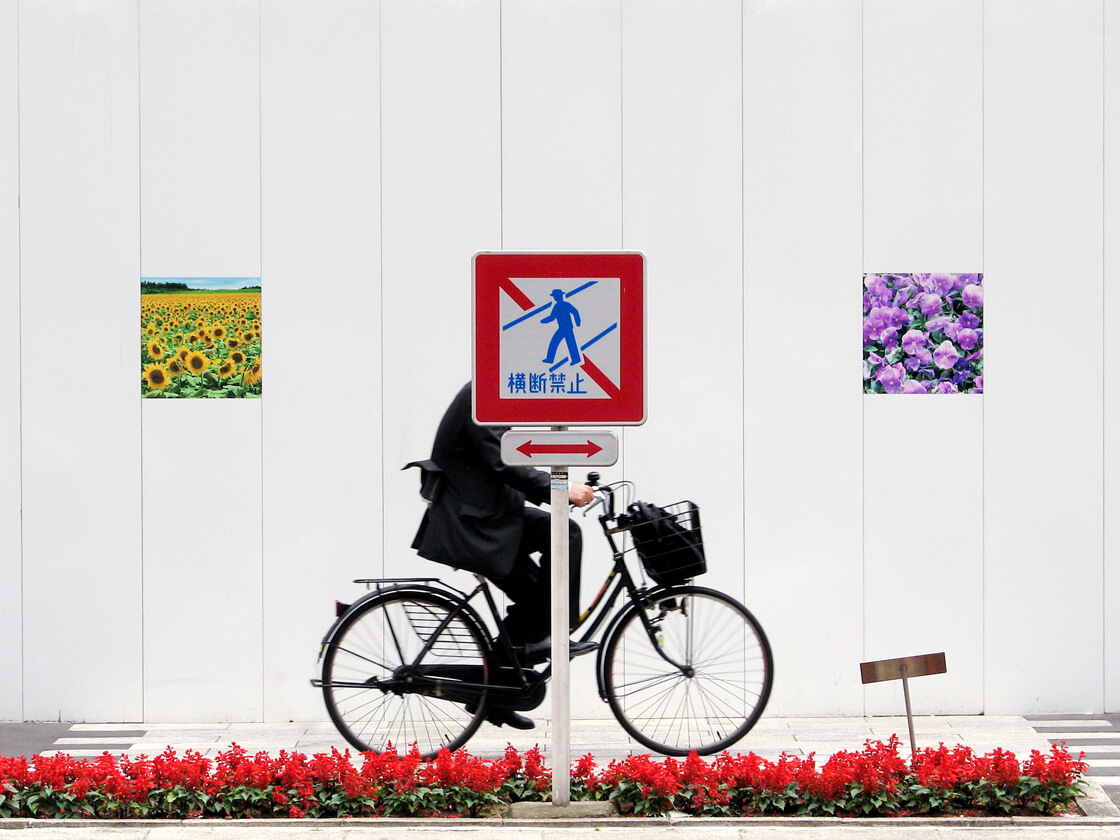 a salaryman on a bicycle in Ginza